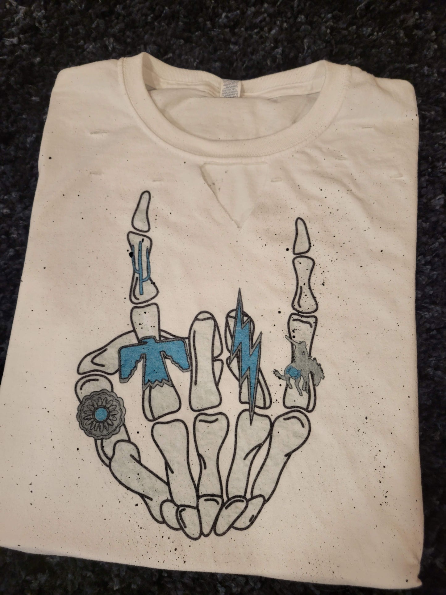 SKELLY HAND WITH TURQUOISE TSHIRT